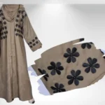 Nida color front open gown abaya with embroidery on the front and sleeves, and pearl work on the sleeves, offering a stylish and elegant design.