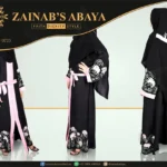 Nida front open gown abaya with a belt and intricate embroidery on the front and sleeves, offering a stylish and modest design.