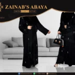 Nida gown abaya with intricate pearl work covering the full gown, offering a luxurious and elegant design.