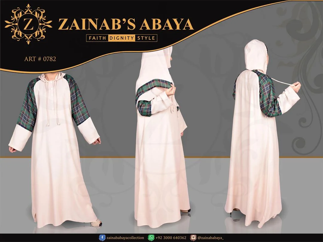 Maxi Abaya Color maxi abaya in Nida fabric with a hoody and chiffon print on the shoulders and arms, offering a modern and stylish look.