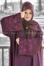 Front Open Abaya in Purple Colored which is crafted in Nida Korean Fabric with Embroidery on Sleeves and motif on the same matching scarf in chiffon fabric.