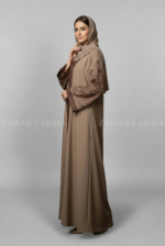 Nida front open gown abaya with delicate embroidery on the sleeves, offering a modest and stylish design.