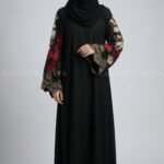Nida color front open gown abaya with intricate embroidery on the sleeves, offering a stylish and elegant design.
