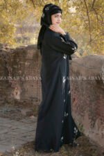 Elegant black abaya with detailed embroidery for a sophisticated and modest look.