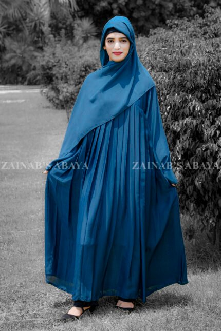 Maxi Abaya in nida korean fabric wth plates style on the front and a matching color scarf.