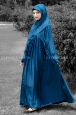 Maxi Abaya in nida korean fabric wth plates style on the front and a matching color scarf.