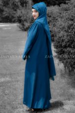 Maxi Abaya in nida korean fabric wth plates style on the front and a matching color scarf.