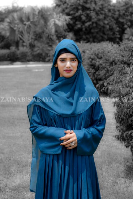 Maxi Abaya in nida korean fabric wth plates style on the front and a matching color scarf.