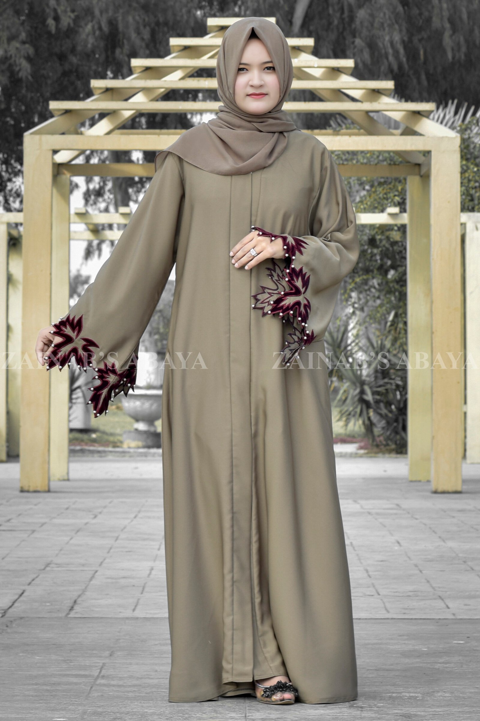 Front Open Abaya in Skin Color With Cut & Pearl Work on Sleeves with Red & White Pearl Combination.
