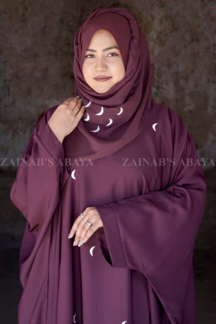 A kaftan Abaya in Nida Korean Fabric with White Color Embroidery in Moon Style.