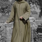 An Elegant Abaya in Front Open Style with Moon Style Embroidery on Sleeves and abaya in Olive Green while embroidery in White Color.