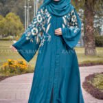 Nida Front Open Abaya with Embroidery on Front & Sleeves in Zinc and tilla gold color combination on front & sleeves as well as same color staler with embroidery motif.