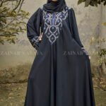 Black Maxi Abaya in Nida Korean Fabric with Embroidery on Front and Cuffs with same color scarf and embroidery motive.