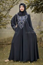 Black Maxi Abaya in Nida Korean Fabric with Embroidery on Front and Cuffs with same color scarf and embroidery motive.
