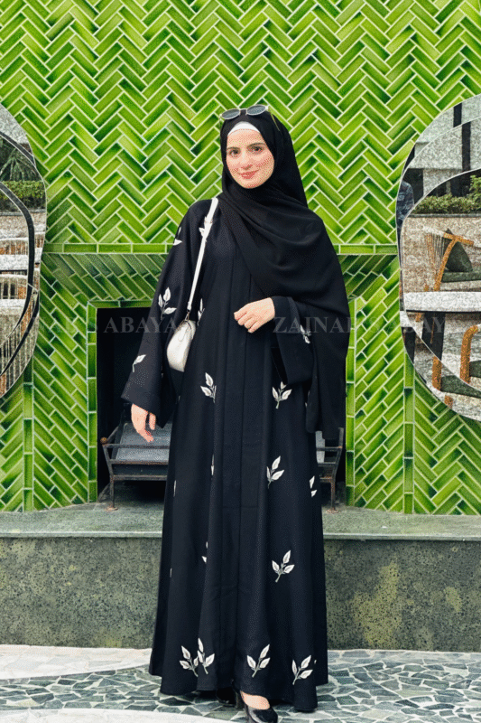 Elegant black abaya with detailed embroidery for a sophisticated and modest look.