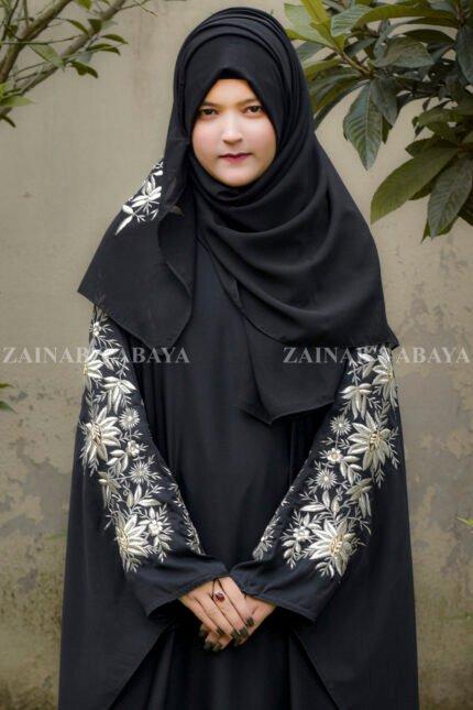 Black Kaftan Abaya in Nida Korean Fabric with Tilla Embroidery on Sleeves front side or at back side as well as motif on matching scarf.