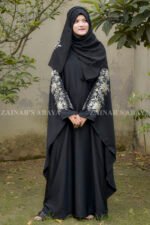 Black Kaftan Abaya in Nida Korean Fabric with Tilla Embroidery on Sleeves front side or at back side as well as motif on matching scarf.