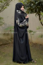 Black Kaftan Abaya in Nida Korean Fabric with Tilla Embroidery on Sleeves front side or at back side as well as motif on matching scarf.