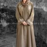 Front Open Abaya in Nida Korean Fabric featuring elegant embroidery on front sleeves cuffs and motif on the scarf. This abaya is in Skin Color
