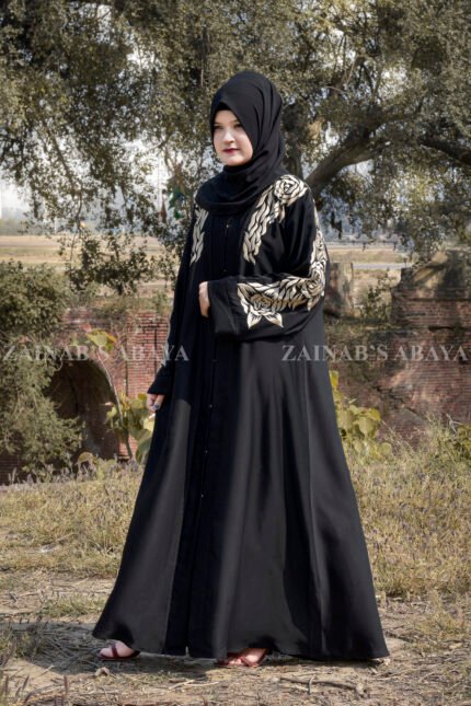 Black Front Open Abaya in Nida Korean Fabric with Sleek Designed Embroidery as well as motif on scarf.