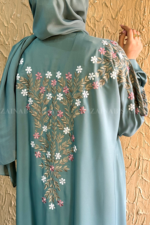 Front Open Abaya in Nida Korean Fabric with Embroidery design on sleeves and backside as well as a motif on the scarf.