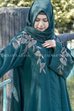 Front Open Abaya in Nida Korean with Embroidery on front and sleeve cuffs as well as motive on the scarf.