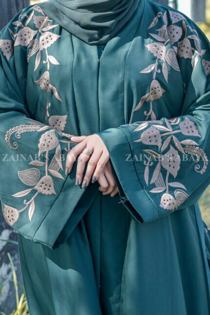 Front Open Abaya in Nida Korean with Embroidery on front and sleeve cuffs as well as motive on the scarf.