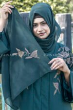 Front Open Abaya in Nida Korean with Embroidery on front and sleeve cuffs as well as motive on the scarf.
