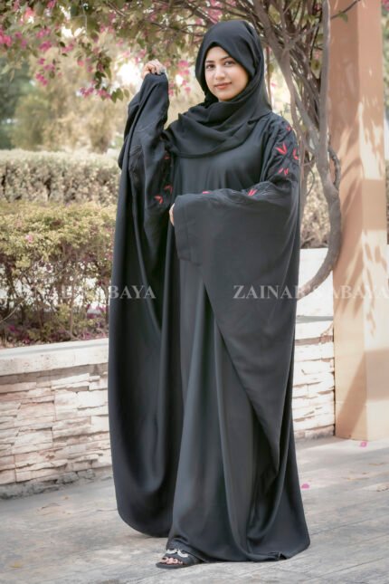 Black Kaftan Abaya in Nida Korean Fabric with Embroidery on sleeves and motif on scarf as well.