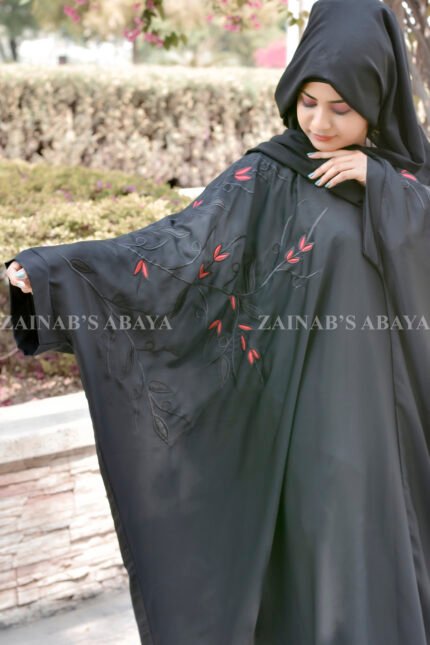 Black Kaftan Abaya in Nida Korean Fabric with Embroidery on sleeves and motif on scarf as well.