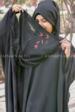 Black Kaftan Abaya in Nida Korean Fabric with Embroidery on sleeves and motif on scarf as well.