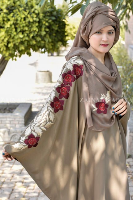 Skin colored kaftan abaya in nida korean fabric with embroidery in floarl style and in red or golden color combination.