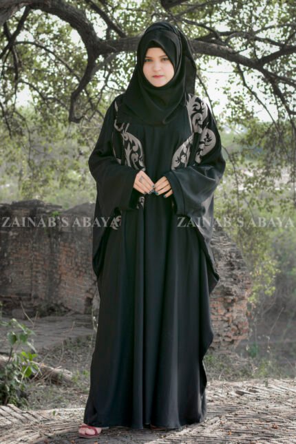 Black Kaftan Abaya In Nida Korean Fabric with Embroidery on it as well as motif on the scarf.