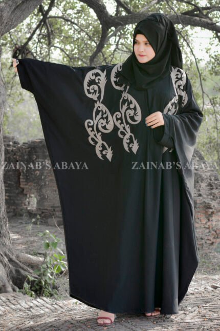 Black Kaftan Abaya In Nida Korean Fabric with Embroidery on it as well as motif on the scarf.
