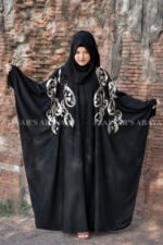 Black Kaftan Abaya In Nida Korean Fabric with Embroidery on it as well as motif on the scarf.
