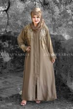 Front Open Abaya in Nida Korean Fabric featuring elegant embroidery on front sleeves cuffs and motif on the scarf. This abaya is in Skin Color