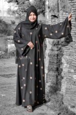 Black Maxi Abaya with Embroidery on Front and Sleeves as well as motif on scarf.