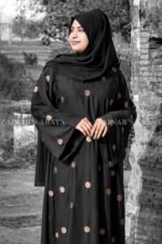 Black Maxi Abaya with Embroidery on Front and Sleeves as well as motif on scarf.