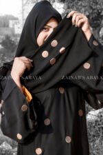 Black Maxi Abaya with Embroidery on Front and Sleeves as well as motif on scarf.