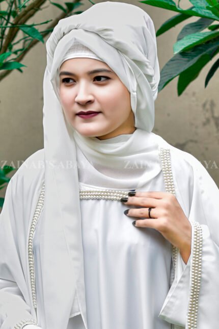 White Kaftan Abaya in Nida Korean Fabric with Elegant Pearl Work on the neck front side or sleeves ends.