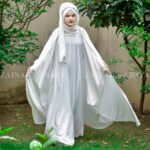 White Kaftan Abaya in Nida Korean Fabric with Elegant Pearl Work on the neck front side or sleeves ends.