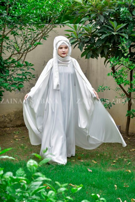 White Kaftan Abaya in Nida Korean Fabric with Elegant Pearl Work on the neck front side or sleeves ends.