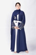 Gown Abaya in Nida Korean Fabric featuring the elegant embroidery on the sleeve ends and inner white gown.