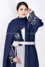 Gown Abaya in Nida Korean Fabric featuring the elegant embroidery on the sleeve ends and inner white gown.