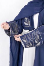 Gown Abaya in Nida Korean Fabric featuring the elegant embroidery on the sleeve ends and inner white gown.