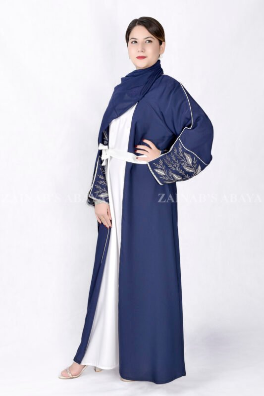 Gown Abaya in Nida Korean Fabric featuring the elegant embroidery on the sleeve ends and inner white gown.