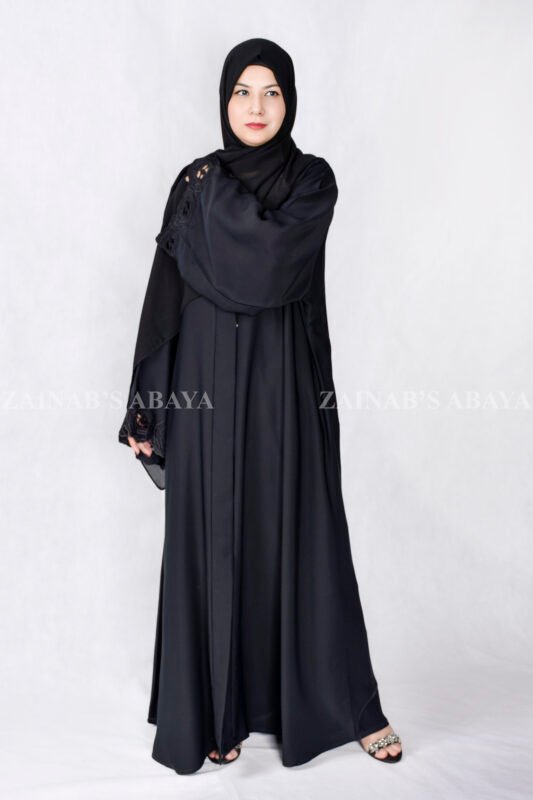 Black Front Open Abaya in Nida Korean Fabric with Elegant Embroidered and Cutwork on the sleeves cuffs as well as matching scarf in chiffon.