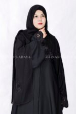 Black Front Open Abaya in Nida Korean Fabric with Elegant Embroidered and Cutwork on the sleeves cuffs as well as matching scarf in chiffon.