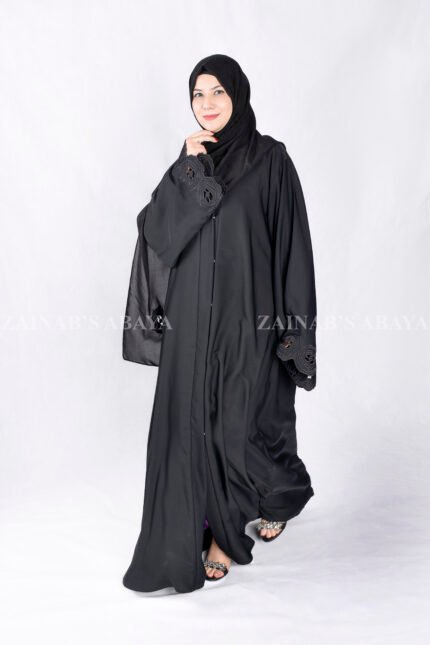 Black Front Open Abaya in Nida Korean Fabric with Elegant Embroidered and Cutwork on the sleeves cuffs as well as matching scarf in chiffon.