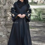 Front Open Abaya in Black Color which is crafted with premium Nida Korean fabric featuring the embroidery on sleeves and backside as well as a matching scarf in chiffon fabric.